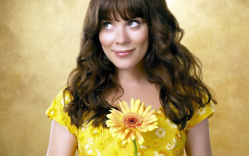 woman with yellow flower