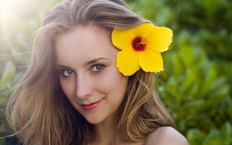 woman with yellow flower