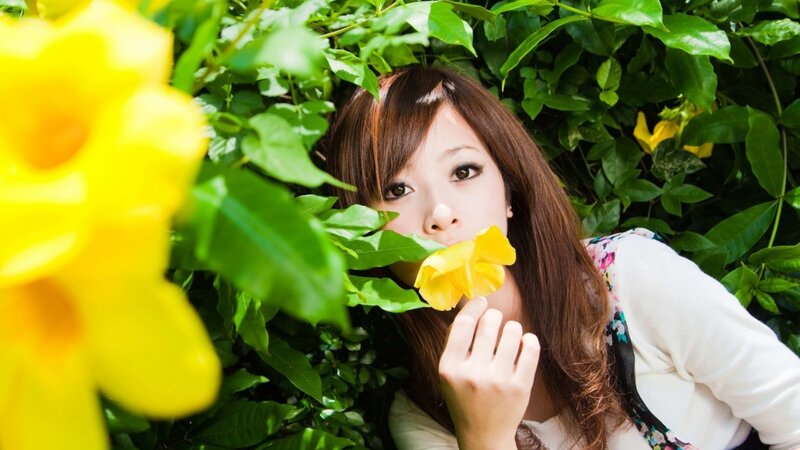 woman with yellow flower