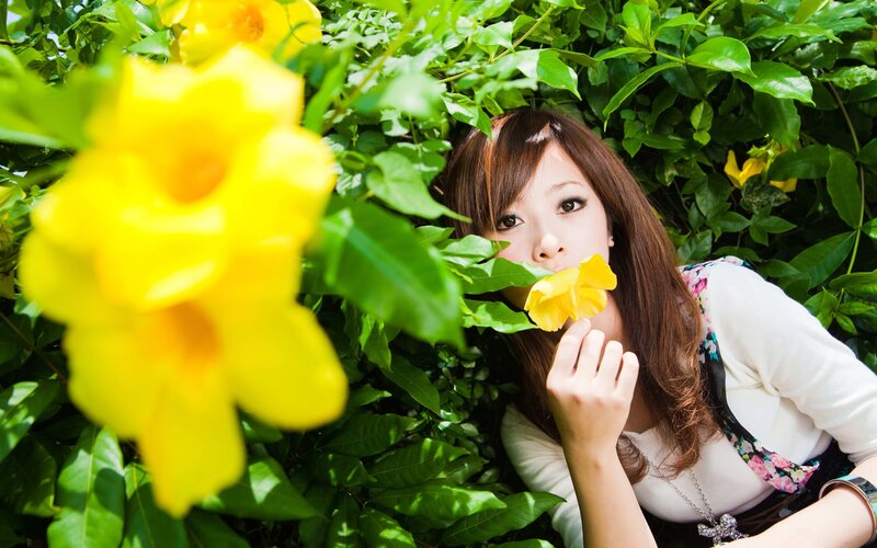 woman with yellow flower