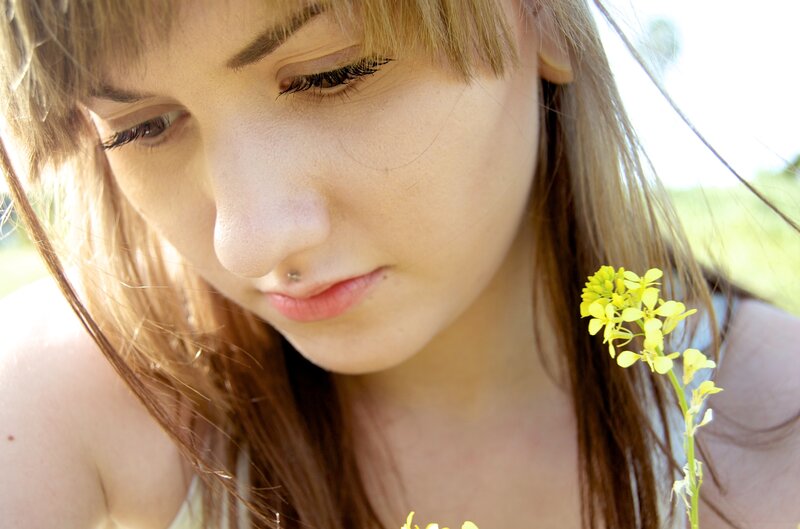 woman with yellow flower