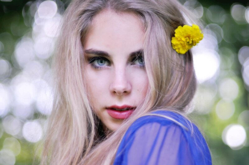 woman with yellow flower in hair
