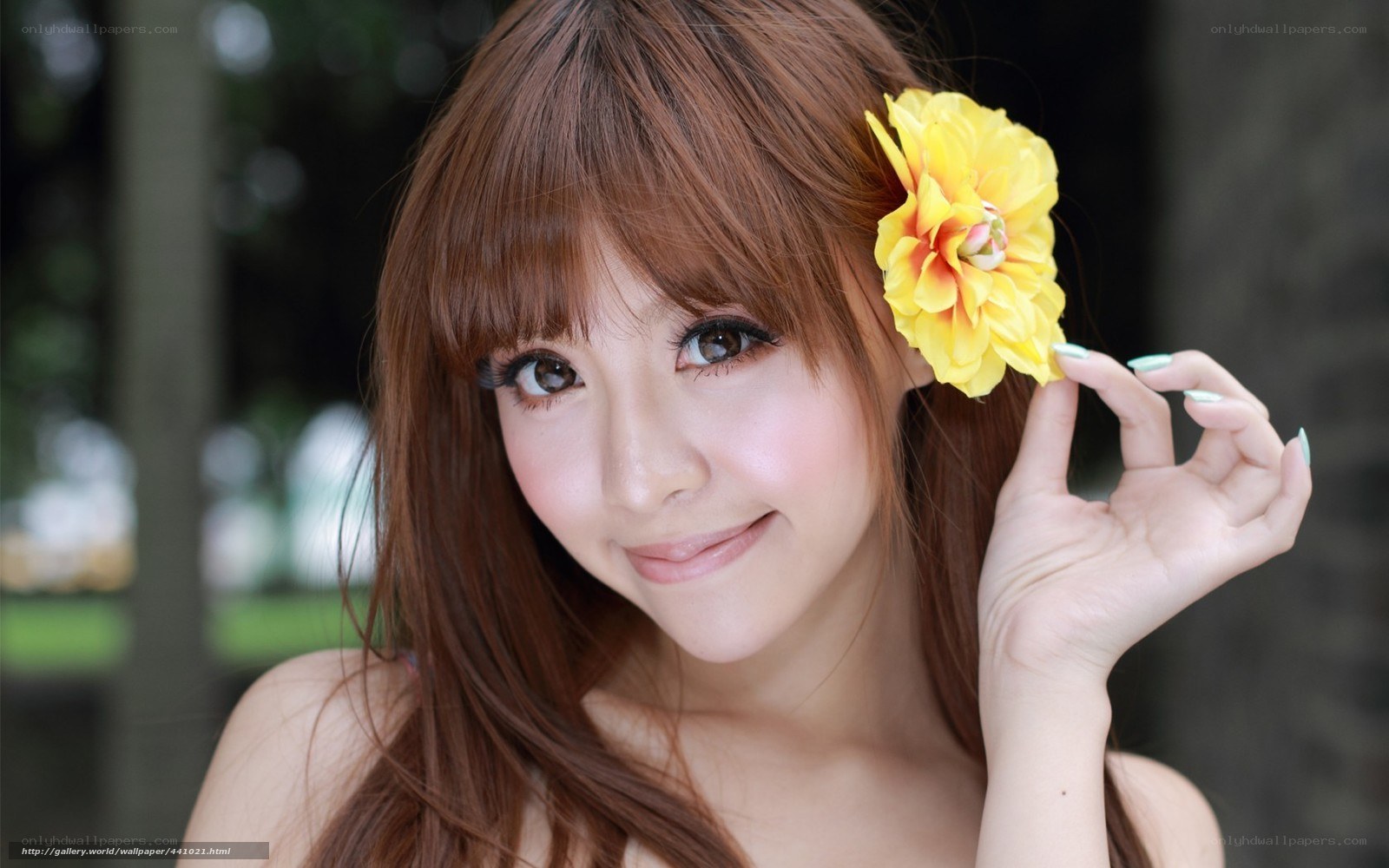 Woman with yellow flower in hair