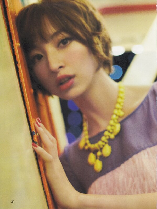 woman with yellow necklace