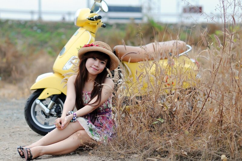 Woman with yellow scooter
