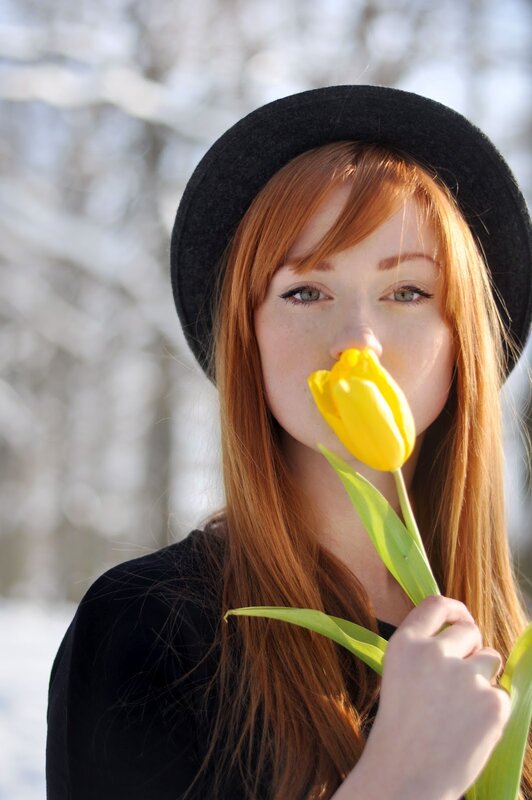 Woman with yellow tulip
