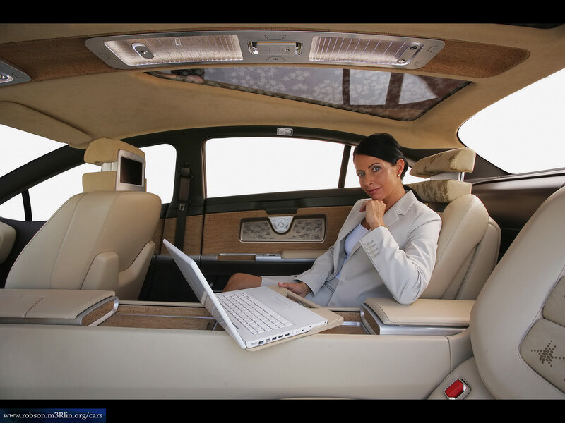 Woman working in luxury car