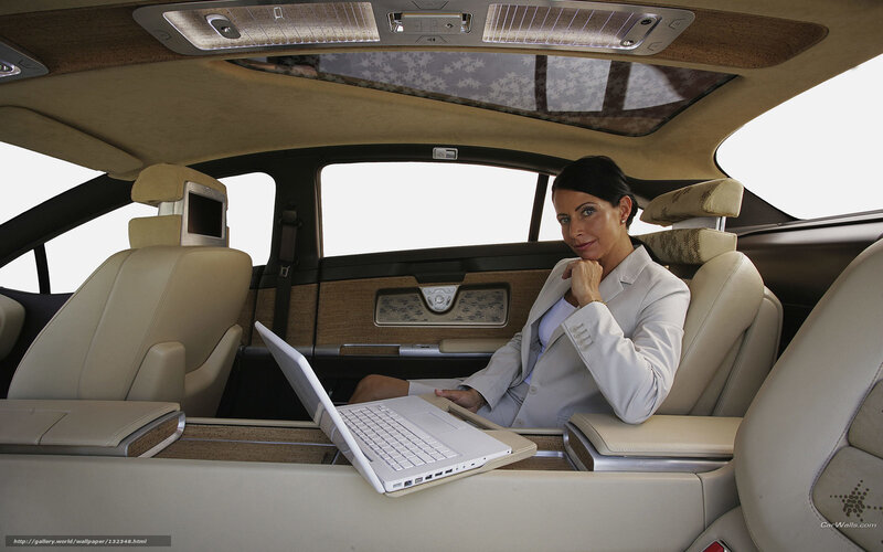 Woman working in luxury car