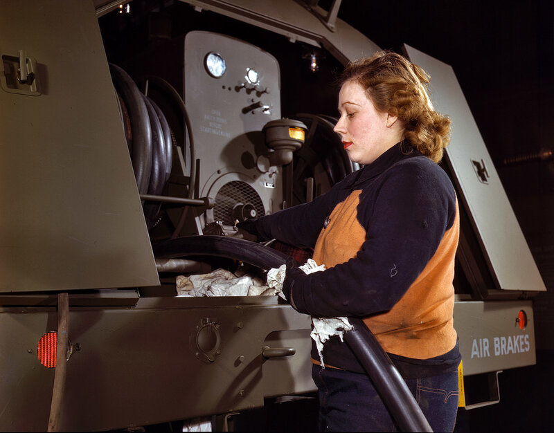 Woman working on air brake system