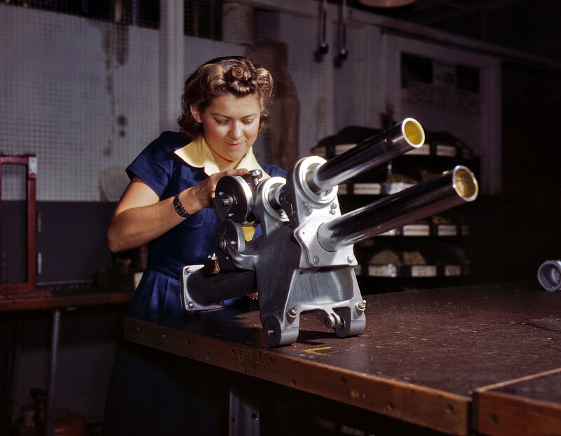Woman working on artillery piece