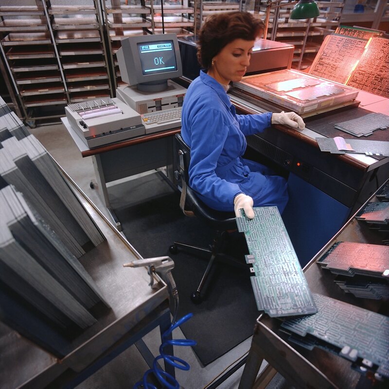 Woman working with circuit boards