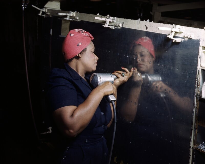 Woman working with industrial tool