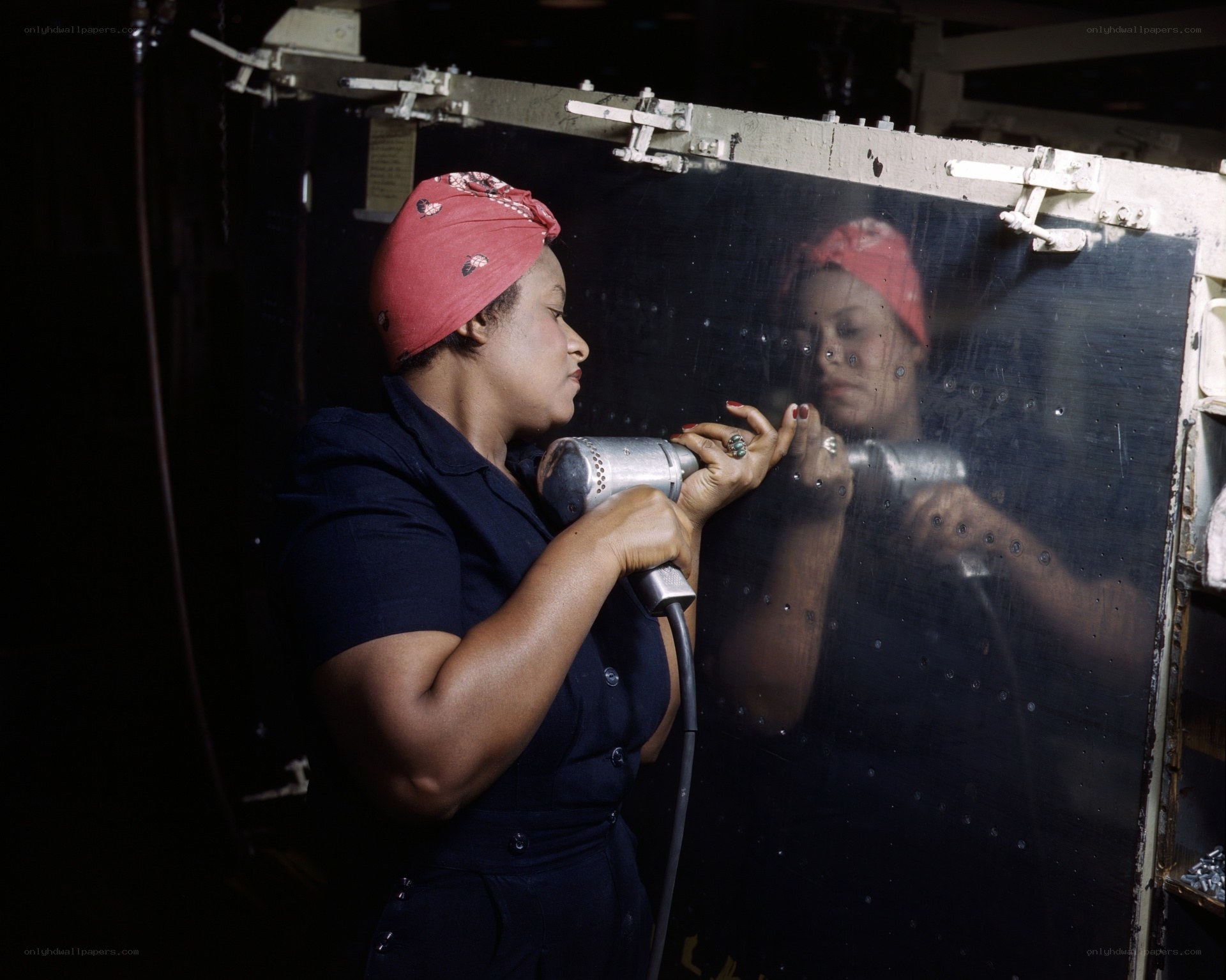 Woman working with industrial tool