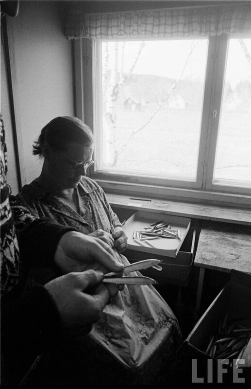 Woman working with metal parts