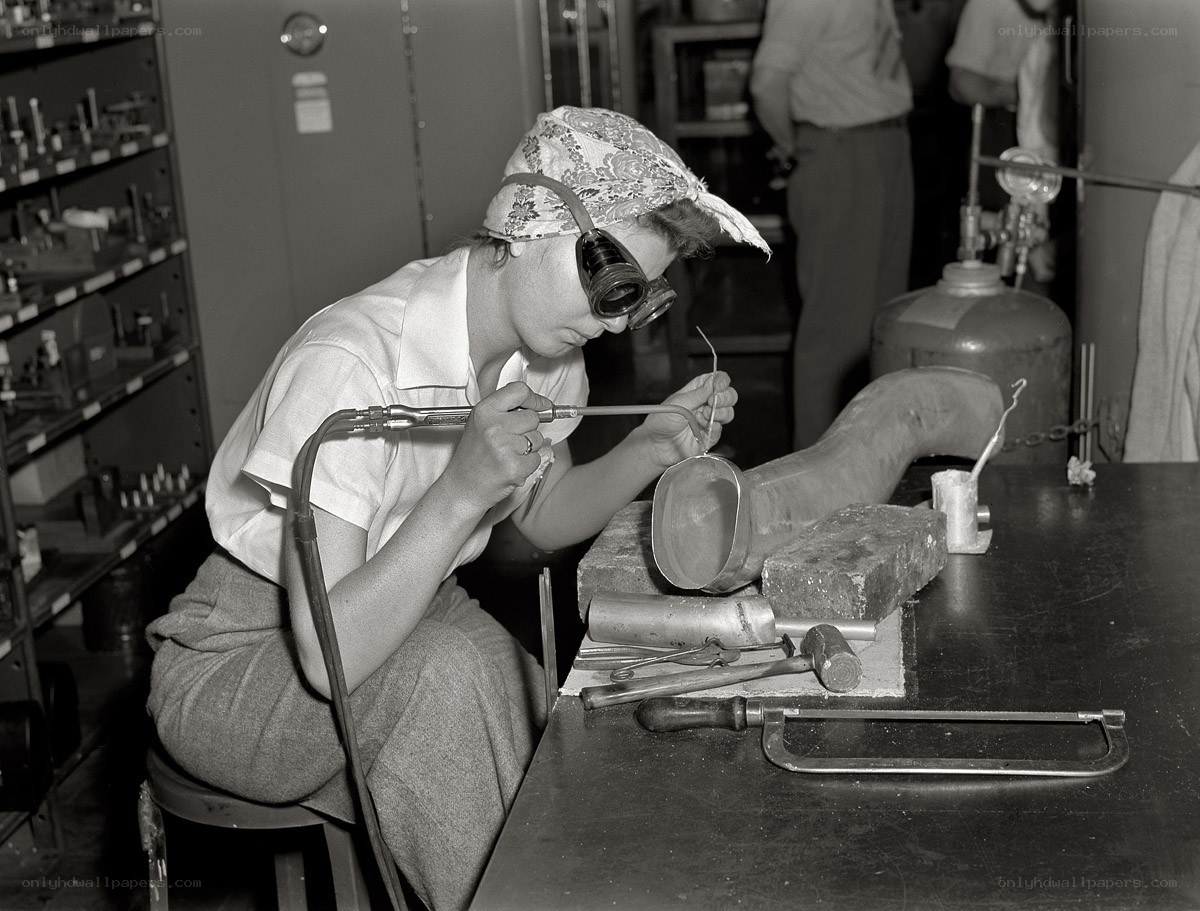 Woman working with metal tools