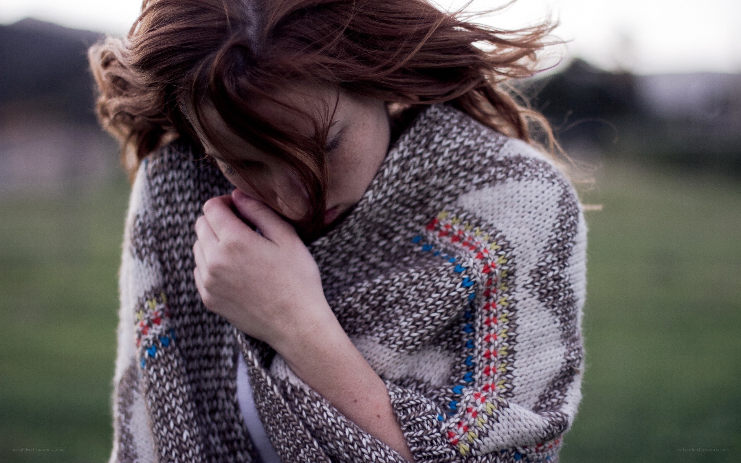 woman wrapped in a blanket