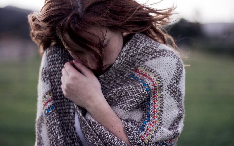 woman wrapped in a scarf