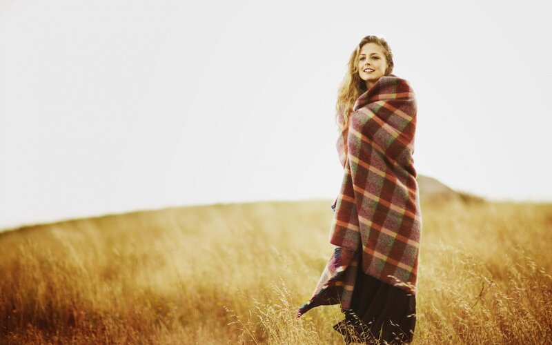 Woman Wrapped in Blanket — Gold