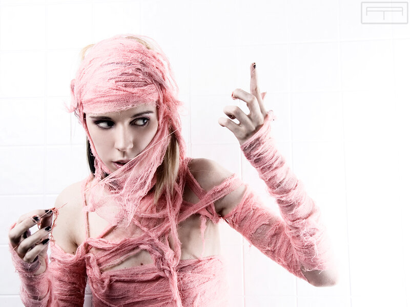woman wrapped in pink bandages