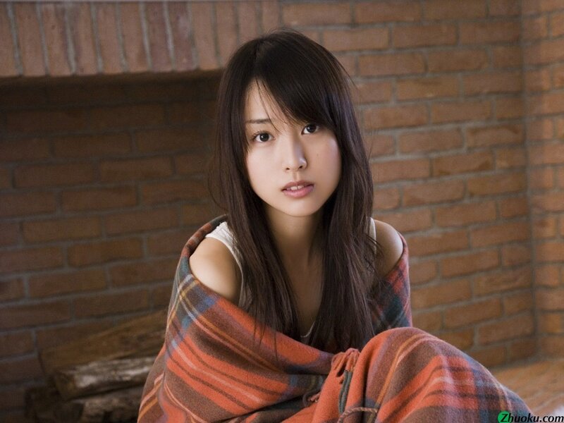 woman wrapped in plaid blanket