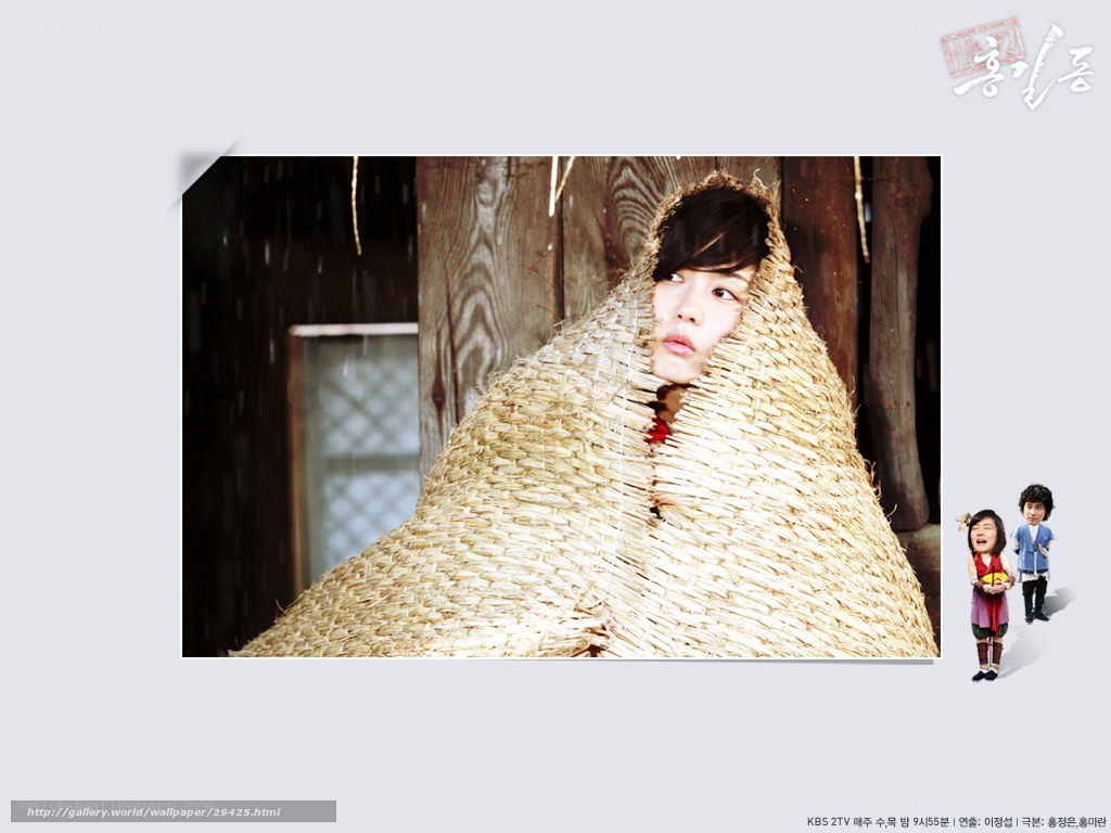 woman wrapped in straw mat
