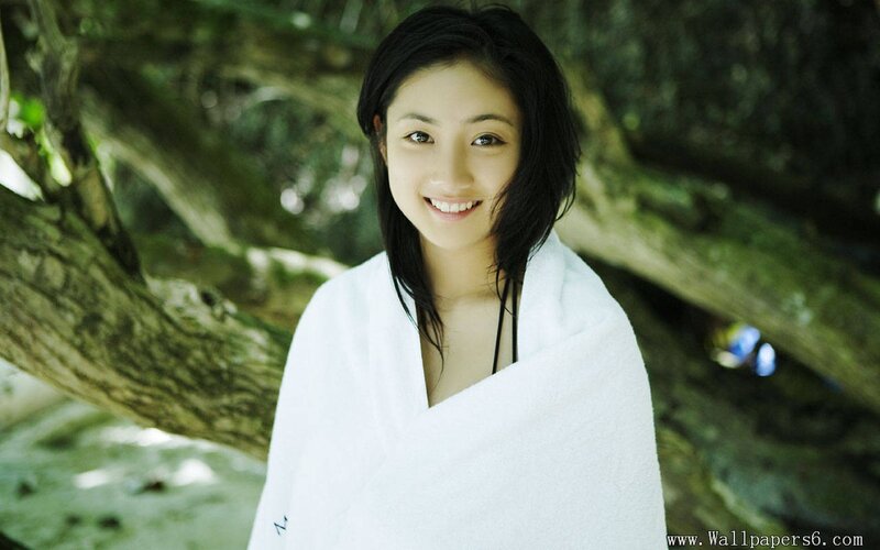 woman wrapped in towel outdoors