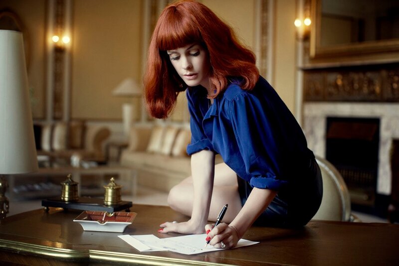 Woman writing at a desk