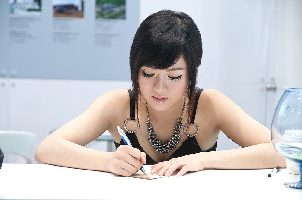 woman writing at a table