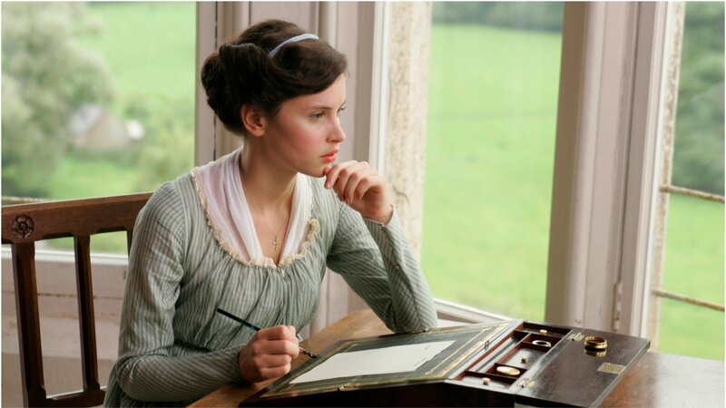 woman writing at desk