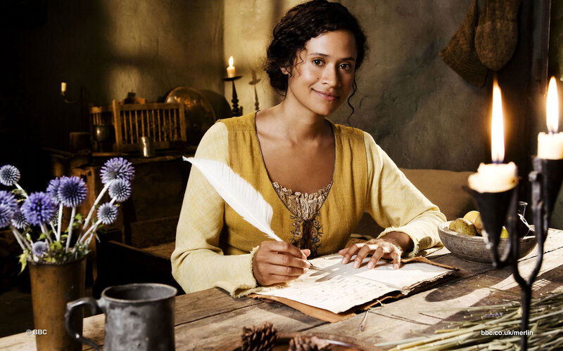 Woman Writing at Table — Yellow