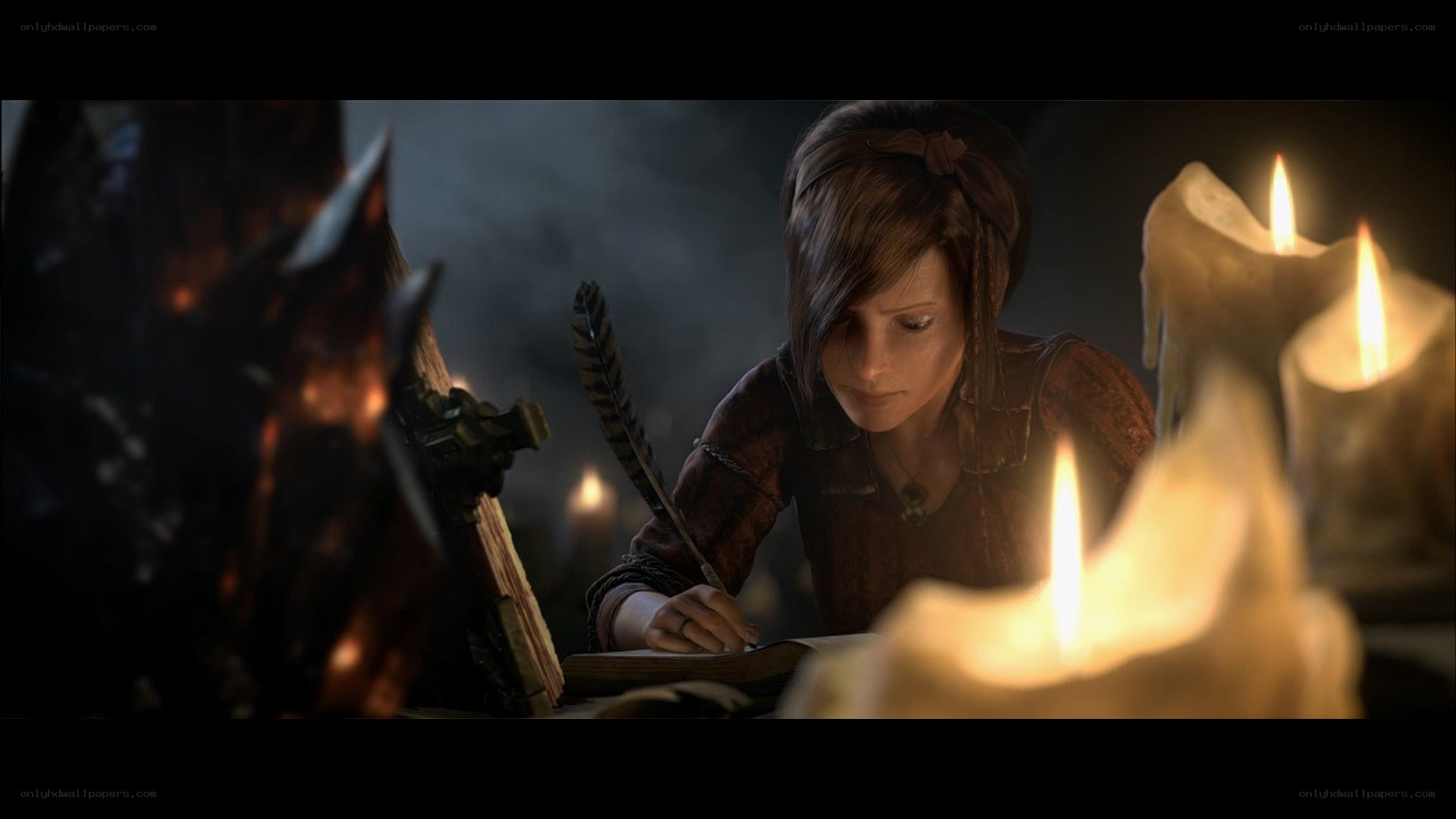 woman writing by candlelight