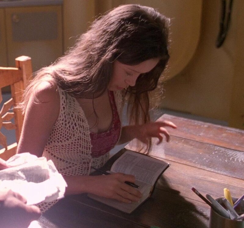 woman writing in a book
