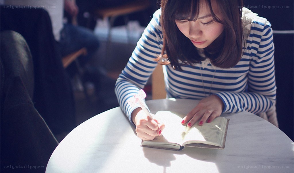 woman writing in a notebook