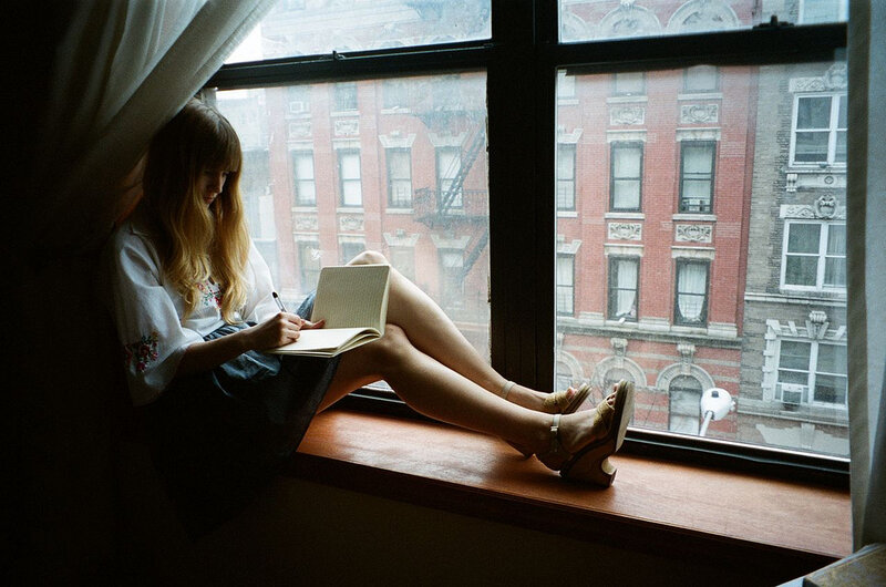 Woman Writing in Notebook — Brown