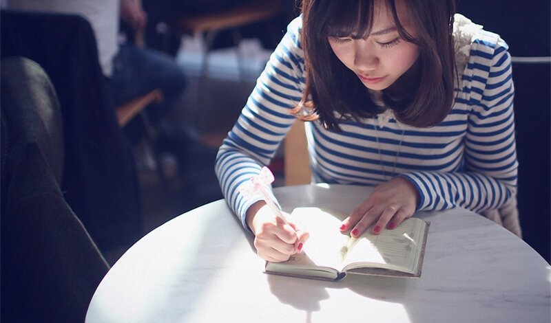 Woman Writing in Notebook — White, Calm