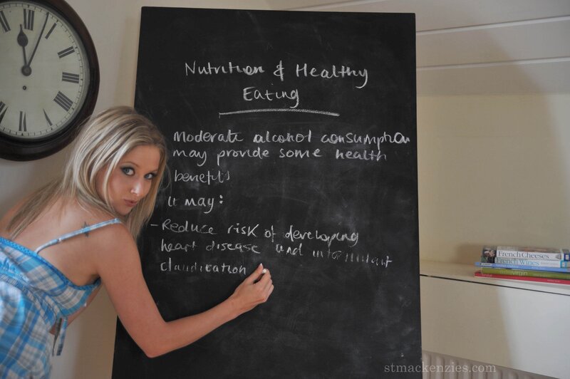 woman writing on chalkboard