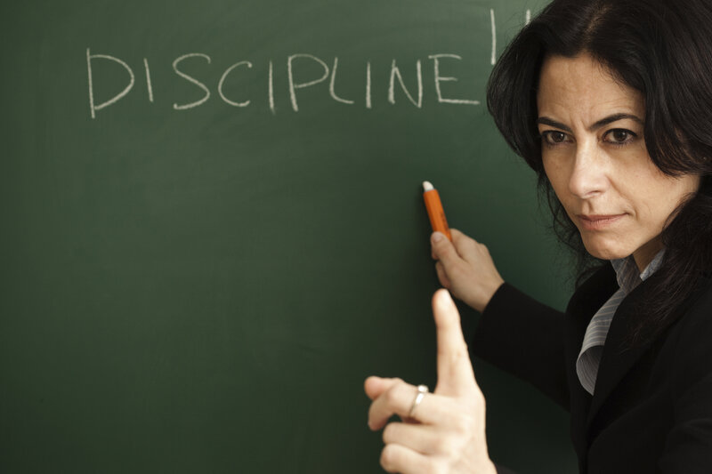 Woman Writing on Chalkboard — Green