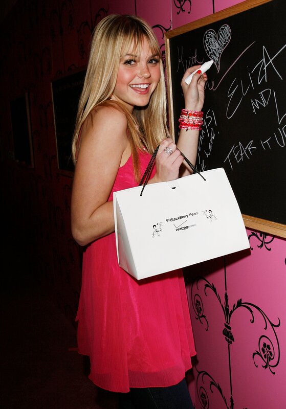 woman writing on chalkboard