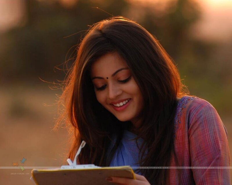 woman writing on clipboard