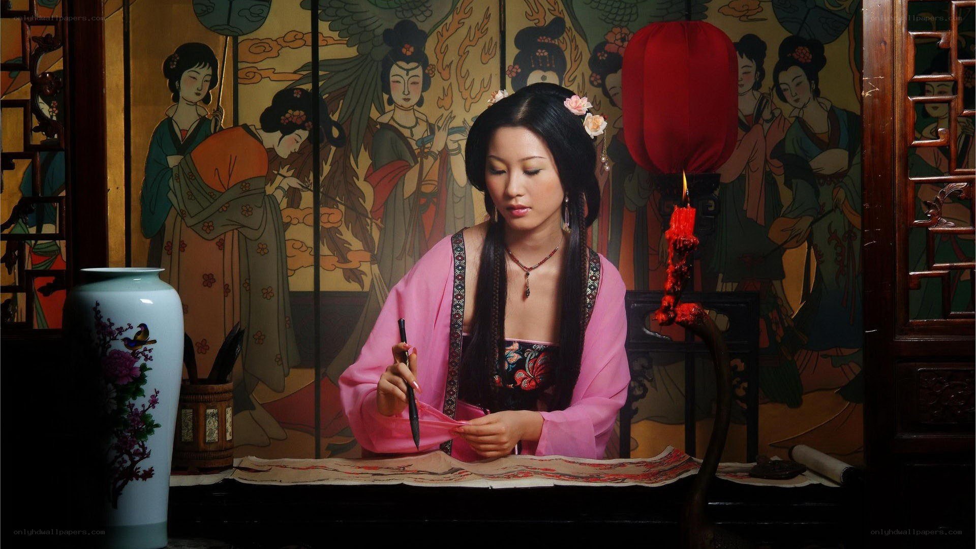 woman writing with brush