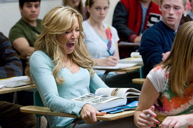 Woman yawning in classroom