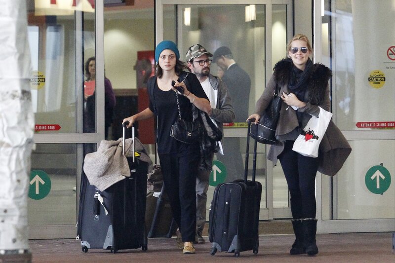 Women arriving at airport with luggage