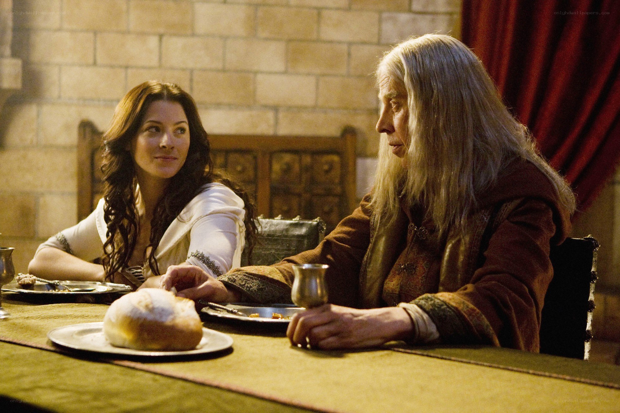 Women at a medieval dinner table