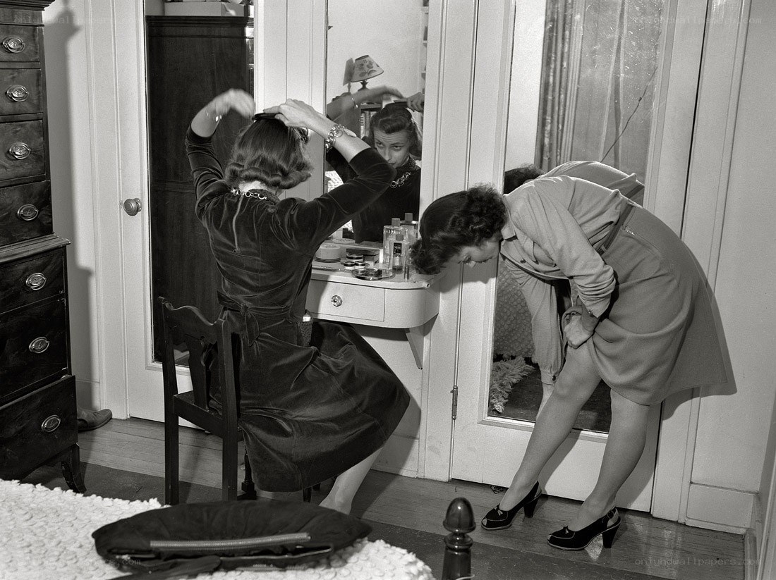Women at a vanity mirror