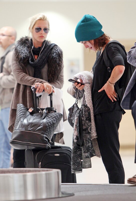 Women at airport baggage claim