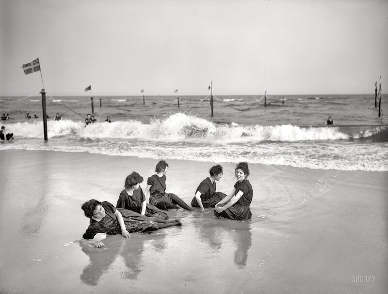 Women at the beach in vintage swimwear