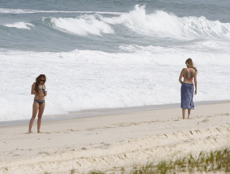 Women at the beach with waves