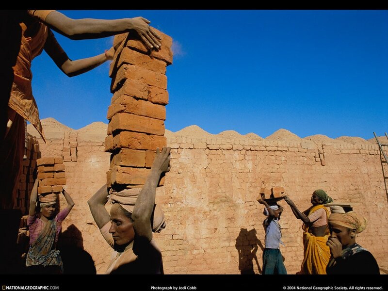Women carrying bricks at a kiln
