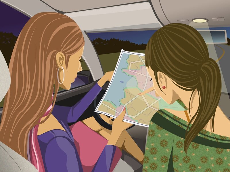 Women checking map in car