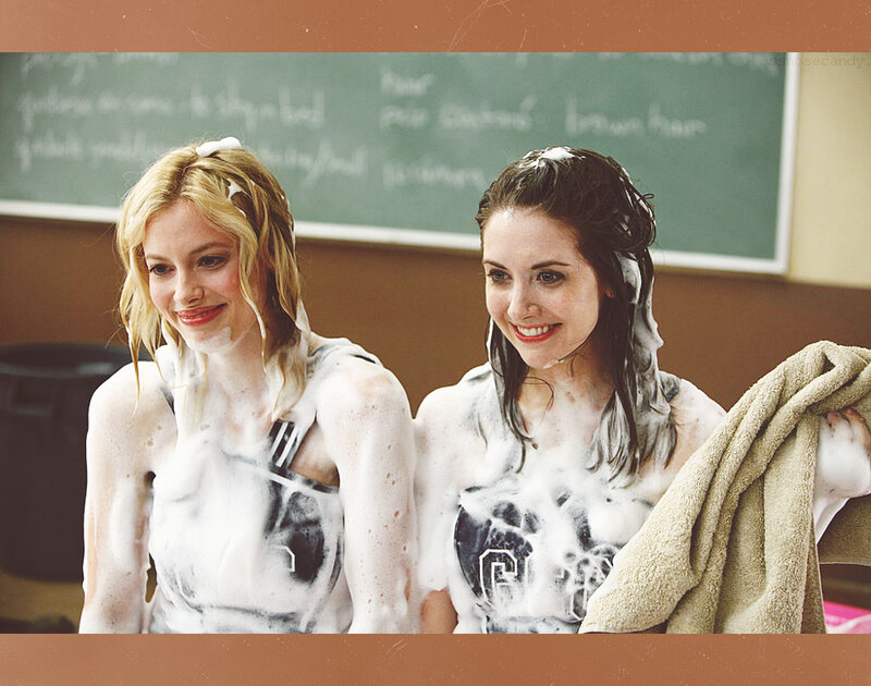 women covered in soap suds